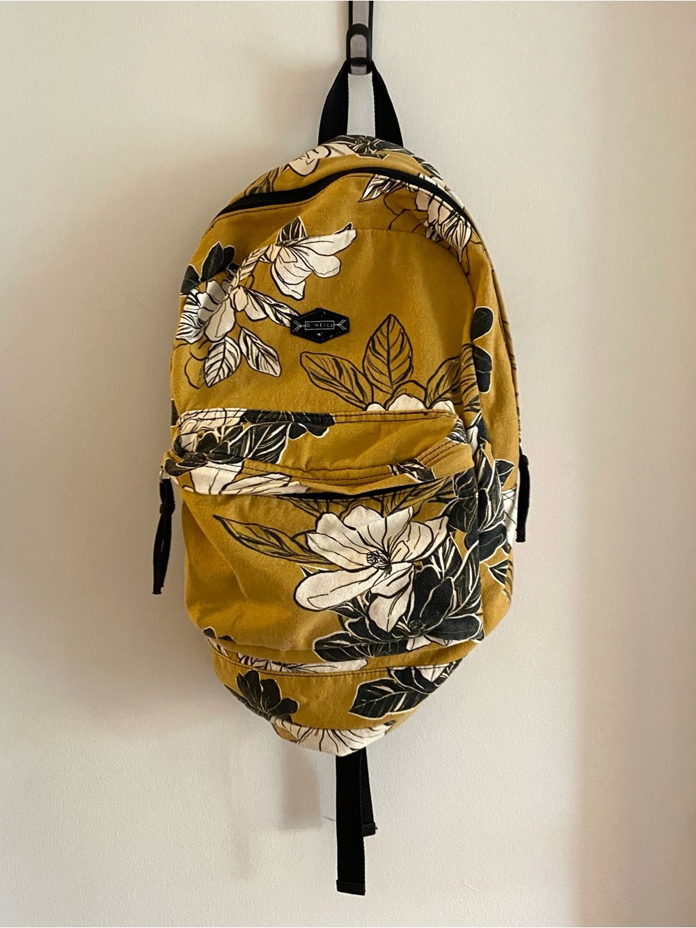 O’Neill backpack mustard yellowblack and white floral pattern